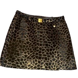 CHANEL Elegant Black and Gold Patterned Mini Skirt